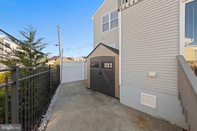 view of patio with a storage shed