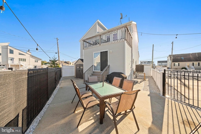 rear view of property featuring a patio area