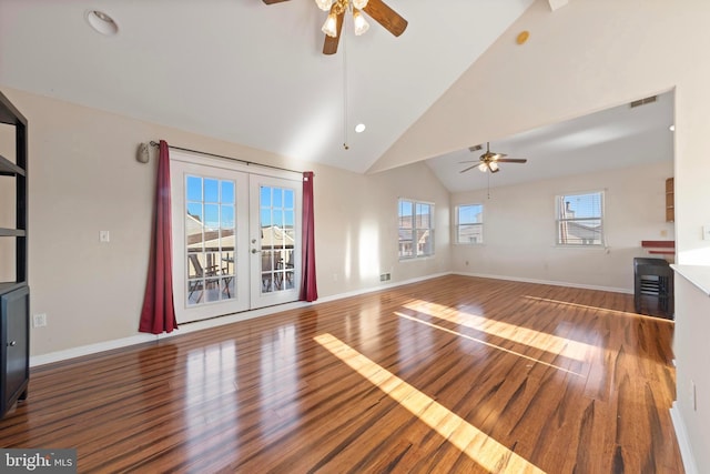 unfurnished living room featuring ceiling fan, french doors, lofted ceiling, and hardwood / wood-style flooring