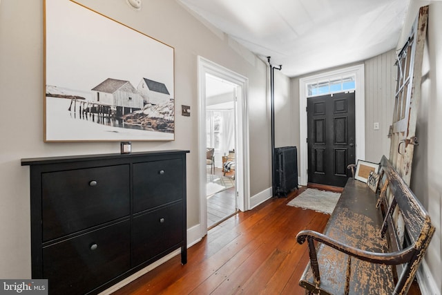 entryway with hardwood / wood-style floors