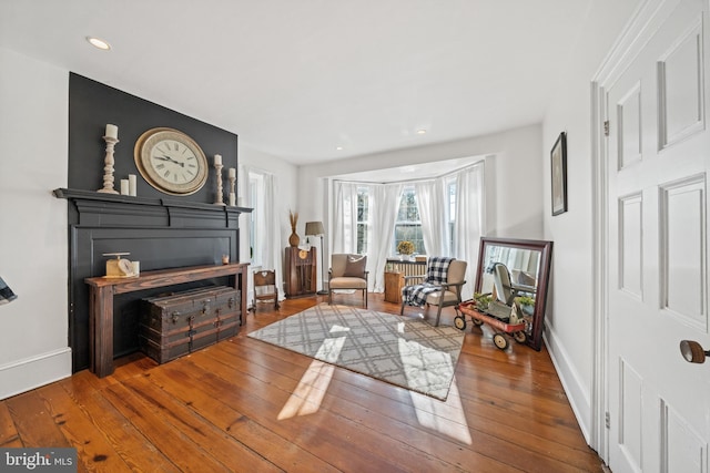 living area with hardwood / wood-style flooring