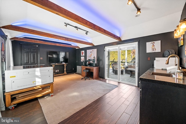 interior space with beamed ceiling and sink