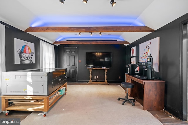 interior space featuring beam ceiling, hardwood / wood-style floors, and rail lighting