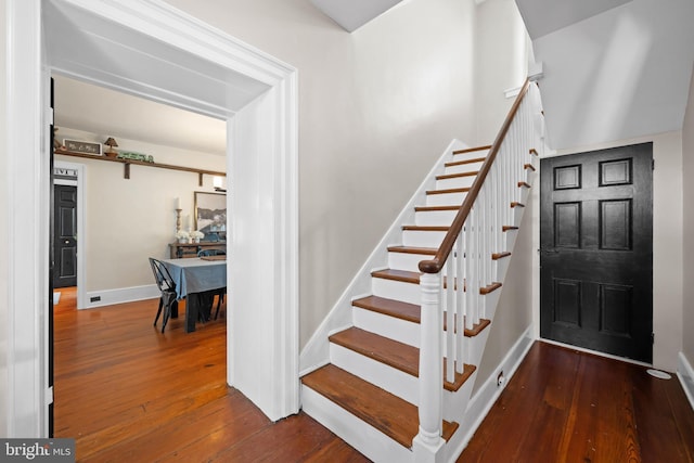 entryway with dark hardwood / wood-style floors