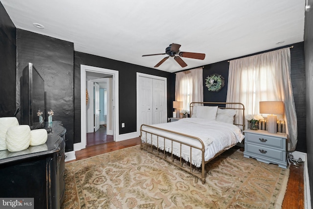 bedroom featuring ceiling fan and hardwood / wood-style floors