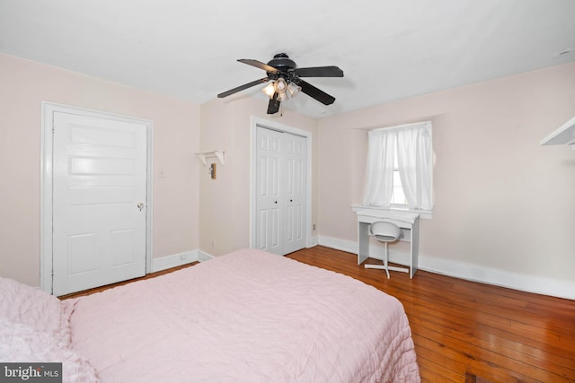 bedroom with ceiling fan and hardwood / wood-style floors