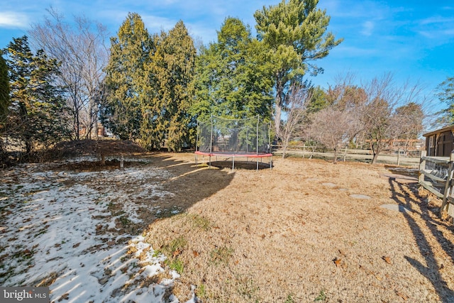 view of yard with a trampoline