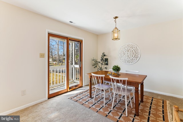 view of carpeted dining space