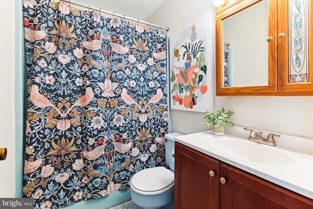 bathroom with vanity and toilet