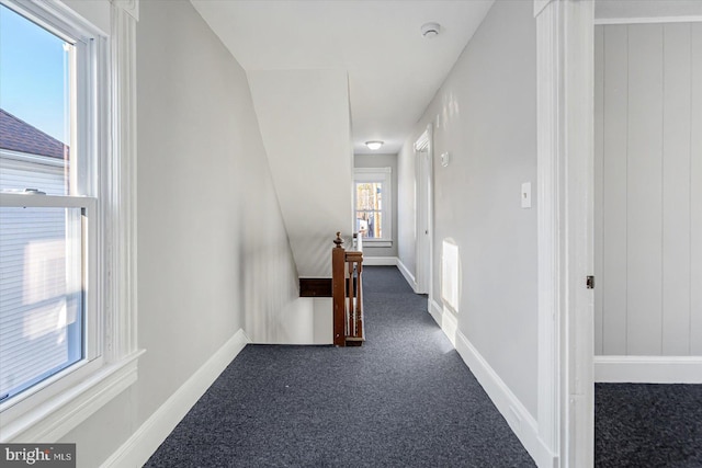 hall with dark carpet