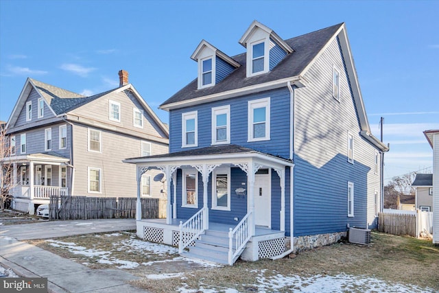 view of front of home featuring a porch and central AC unit