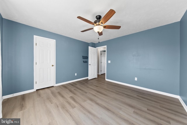 unfurnished bedroom featuring light hardwood / wood-style flooring and ceiling fan