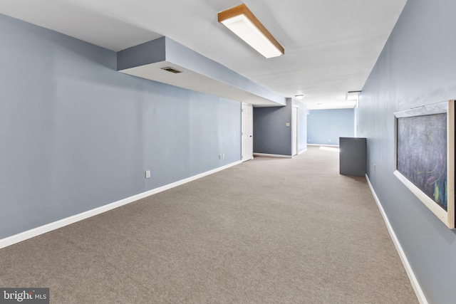 basement with light colored carpet