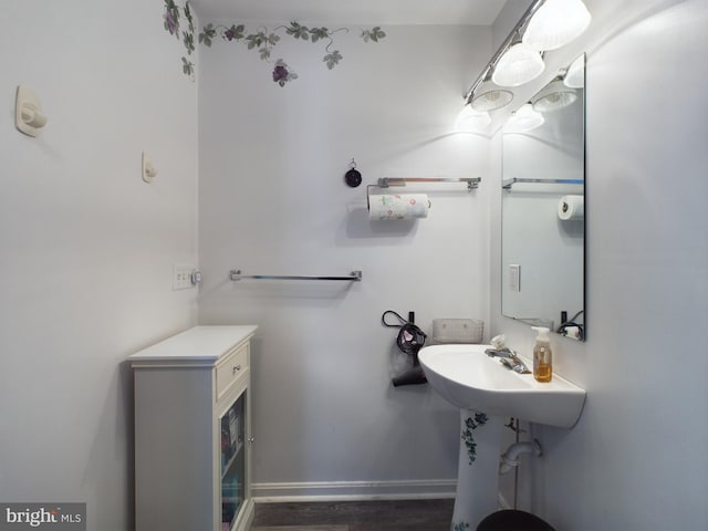 bathroom with hardwood / wood-style floors and sink