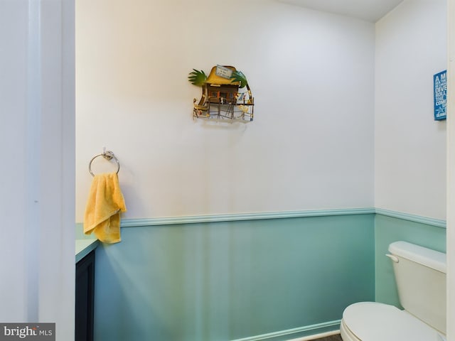 bathroom featuring toilet and vanity