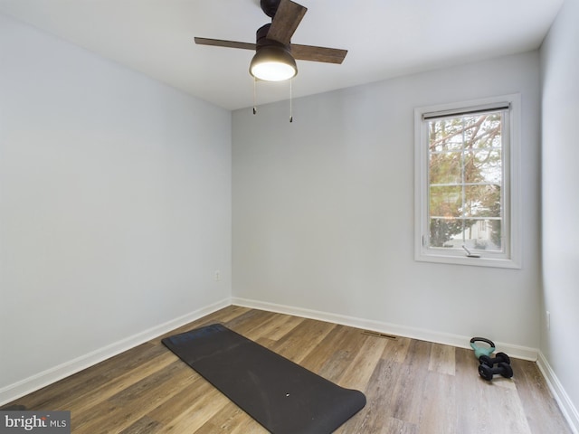 unfurnished room featuring ceiling fan and hardwood / wood-style flooring