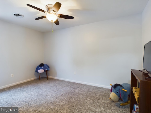 empty room with ceiling fan and carpet flooring