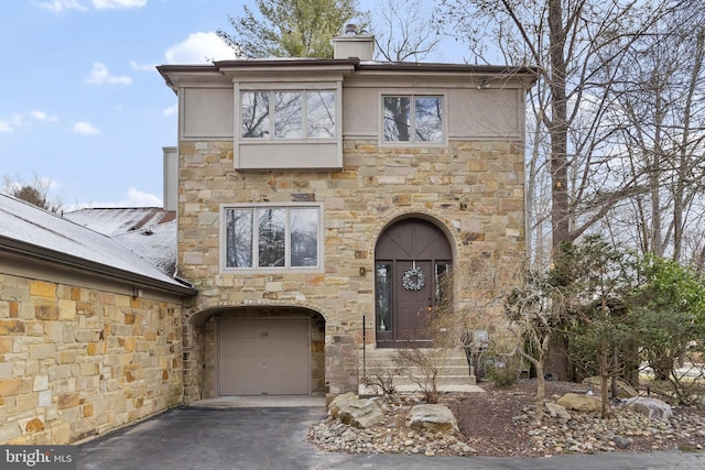 view of front of property with a garage