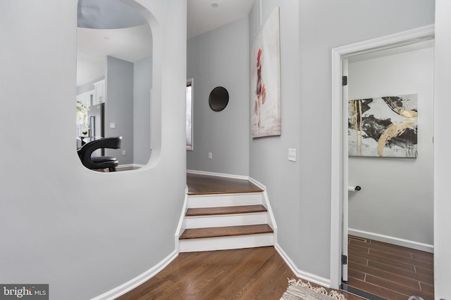 stairs with wood-type flooring