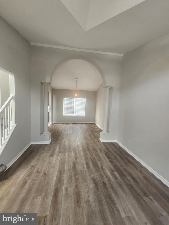 unfurnished living room featuring wood-type flooring