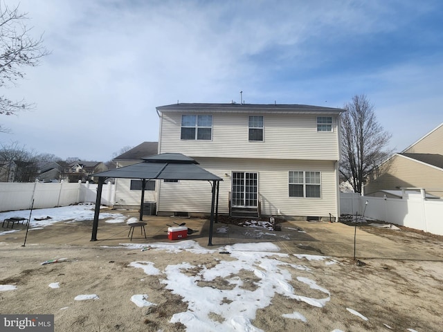 rear view of property with a gazebo