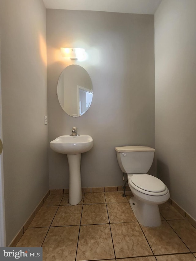 bathroom featuring tile patterned floors and toilet