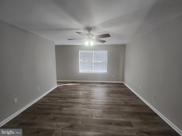 unfurnished room featuring ceiling fan and dark hardwood / wood-style floors