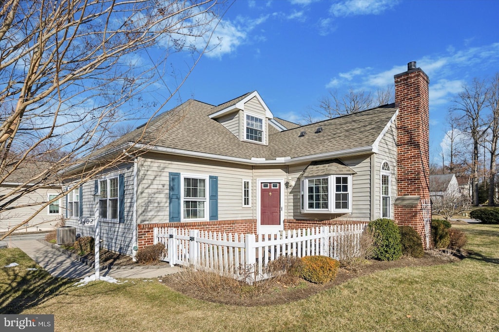 cape cod-style house with a front yard and cooling unit