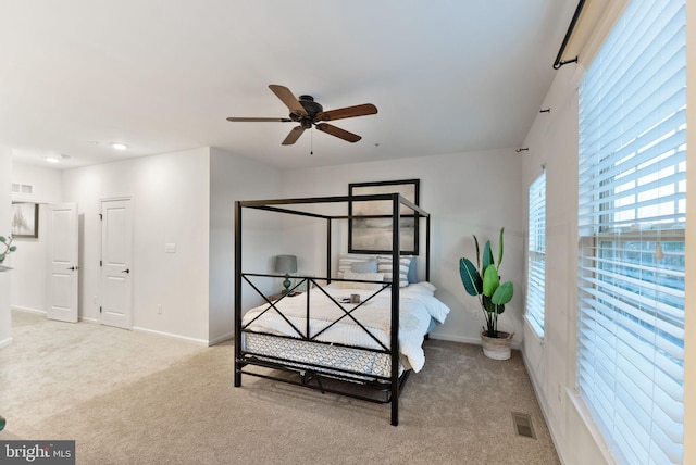 carpeted bedroom featuring ceiling fan