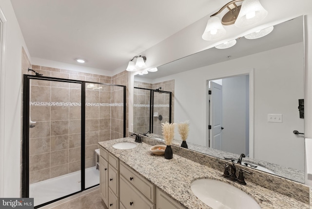 bathroom with vanity and an enclosed shower