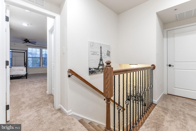 hallway with light carpet