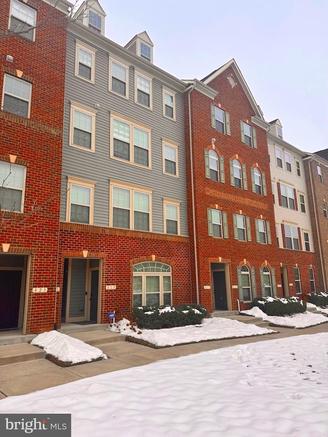 view of snow covered property