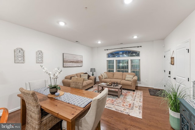 dining room with dark hardwood / wood-style flooring