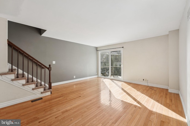 spare room featuring light hardwood / wood-style flooring