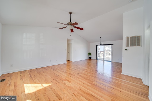 spare room with vaulted ceiling, light wood-type flooring, and ceiling fan