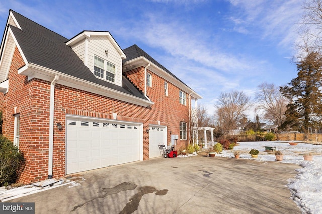 view of side of property with a garage