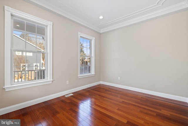 unfurnished room with crown molding and hardwood / wood-style floors