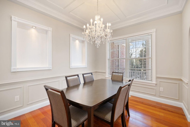 dining room featuring ornamental molding and light wood-type flooring