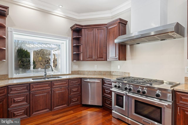 kitchen featuring sink, ornamental molding, stainless steel appliances, light stone countertops, and wall chimney range hood