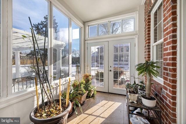 sunroom featuring french doors