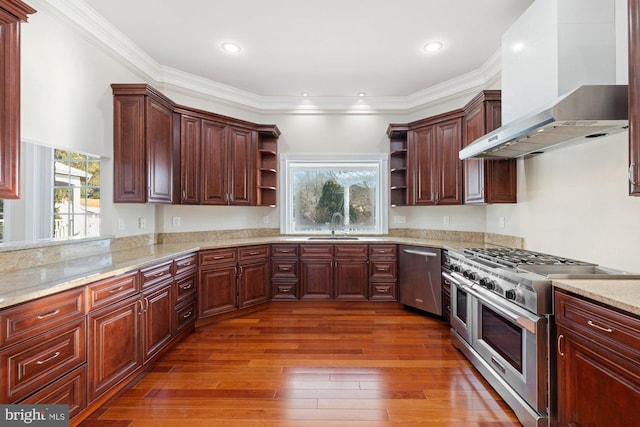 kitchen with sink, stainless steel appliances, light stone counters, extractor fan, and dark hardwood / wood-style flooring