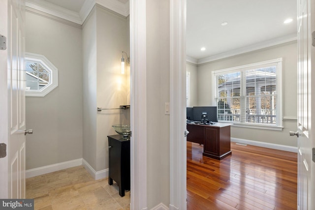 office area with ornamental molding and light hardwood / wood-style flooring