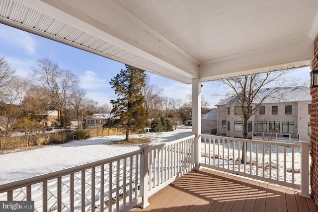 view of snow covered deck