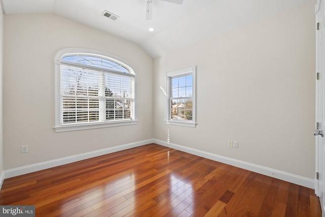 unfurnished room featuring hardwood / wood-style flooring, vaulted ceiling, and ceiling fan