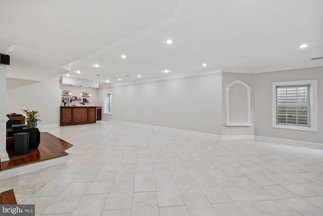 interior space with crown molding and plenty of natural light