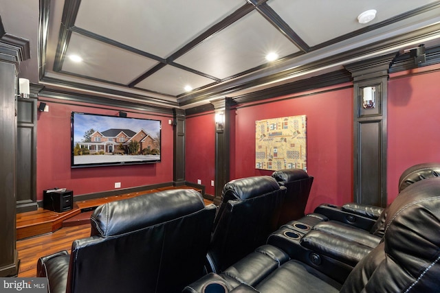 cinema room featuring ornate columns and ornamental molding