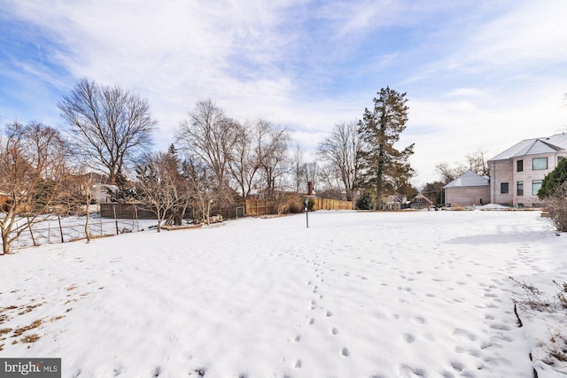 view of yard layered in snow