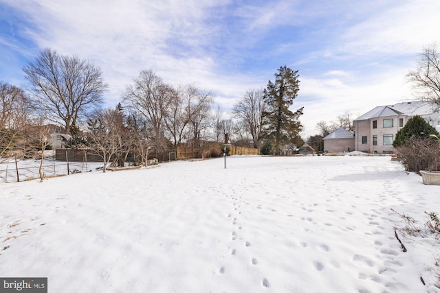 view of yard covered in snow