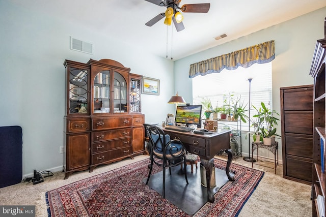 office area with baseboards, visible vents, and ceiling fan