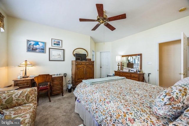 bedroom featuring ceiling fan, vaulted ceiling, and light carpet